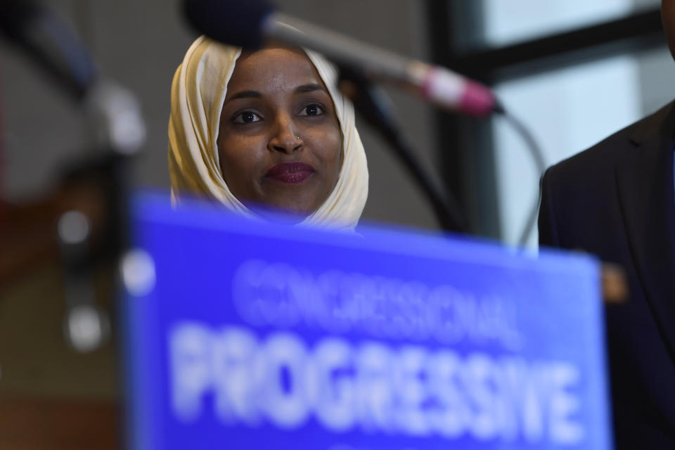 Rep.-elect Ilhan Omar, D-Minn., listens during a news conference with members of the Progressive Caucus in Washington, Monday, Nov. 12, 2018. (AP Photo/Susan Walsh)