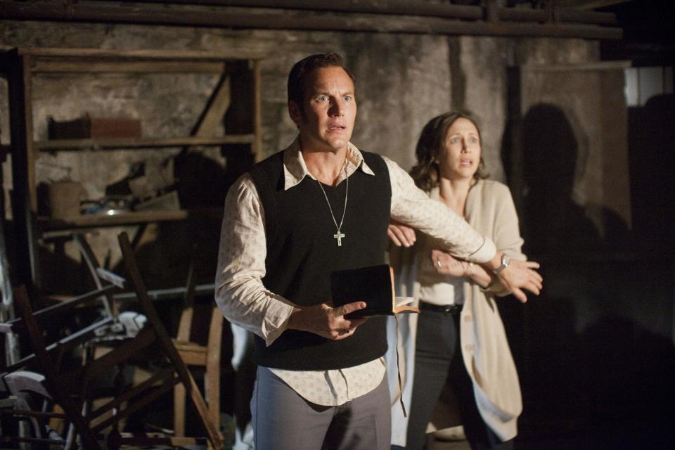 In this publicity image released by Warner Bros. Pictures, Patrick Wilson portrays Ed Warren, left, and Vera Farmiga portrays Lorraine Warren in a scene from “The Conjuring.” (AP Photo/New Line Cinema/Warner Bros. Pictures, Michael Tackett)