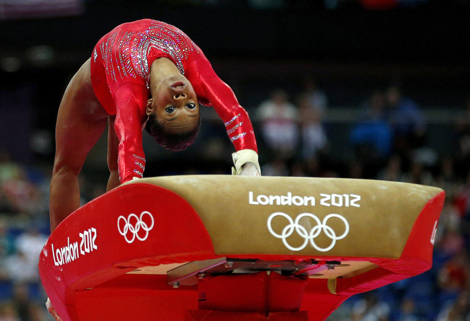 <p>Nicknamed the ‘Flying Squirrel,’ Gabby Douglas performs on the vault during the women’s gymnastics team final at the 2012 London Games. (Brian Snyder/Reuters) </p>