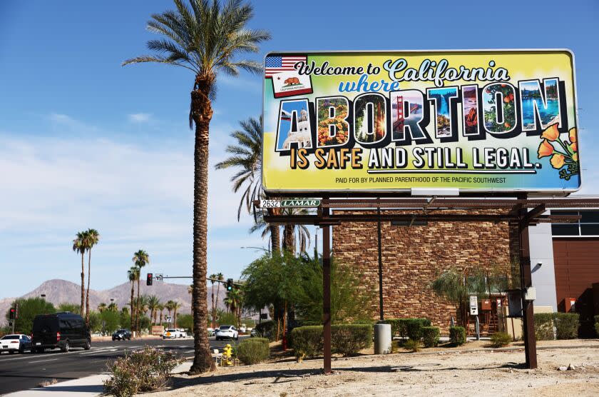 RANCHO MIRAGE, CALIFORNIA - JULY 12: A billboard reads, 'Welcome to California where abortion is safe and still legal' on July 12, 2022 in Rancho Mirage, California. The billboard was paid for by Planned Parenthood of the Pacific Southwest. The number of patients from outside states increased 900 percent at Planned Parenthood clinics in San Bernardino and Orange counties the week following the Supreme Court's decision in the Dobbs v Jackson Women's Health case. The decision overturned the landmark 50-year-old Roe v Wade case and erased a federal right to an abortion. (Photo by Mario Tama/Getty Images)