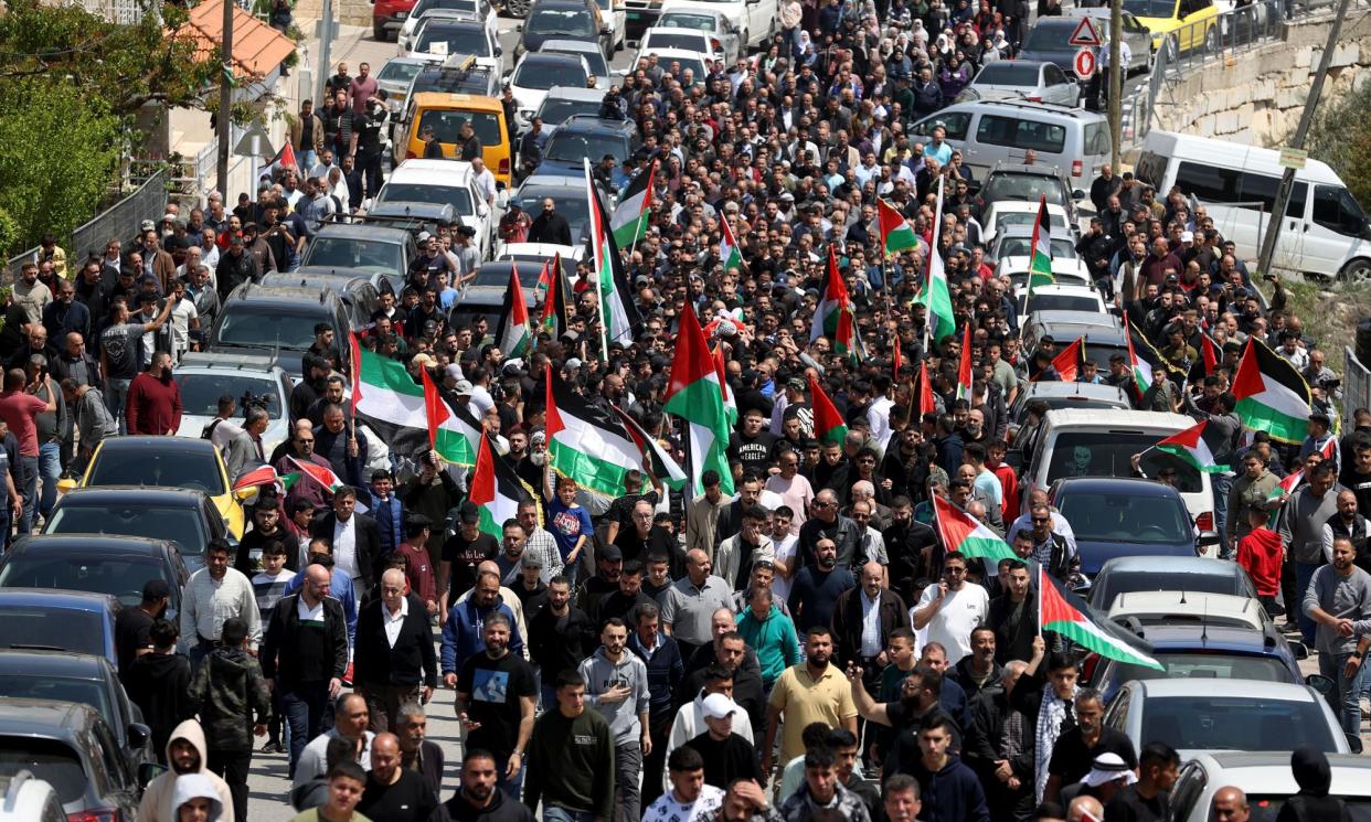 <span>People attend a funeral of a Palestinian killed during an armed attack by Jewish settlers in Ramallah.</span><span>Photograph: Anadolu/Getty Images</span>