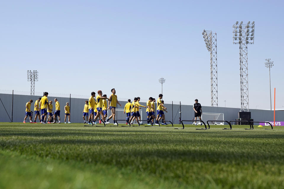 Players warm up during Japan official training on the eve of the group E of World Cup soccer match between Japan and Costa Rica, in Doha, Qatar, Saturday, Nov. 26, 2022. (AP Photo/Eugene Hoshiko)