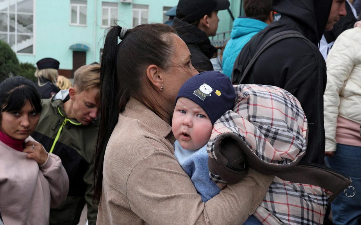 Civilians evacuated from the Russian-controlled Kherson region - REUTERS/Alexey Pavlishak 