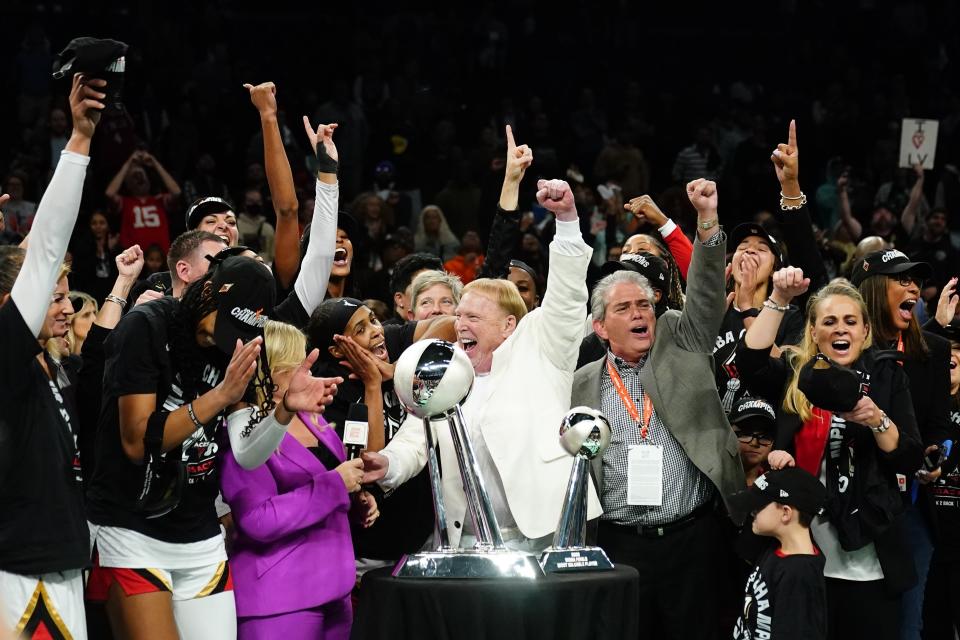 FILE- The Las Vegas Aces celebrate with the trophy after Game 4 of a WNBA basketball final playoff series against the New York Liberty Wednesday, Oct. 18, 2023, in New York. The two-time defending WNBA champion Las Vegas Aces are favored to win the title again. They return their core four players to the roster from a team that became the first in more than 20 years to repeat as champions. (AP Photo/Frank Franklin II, File)