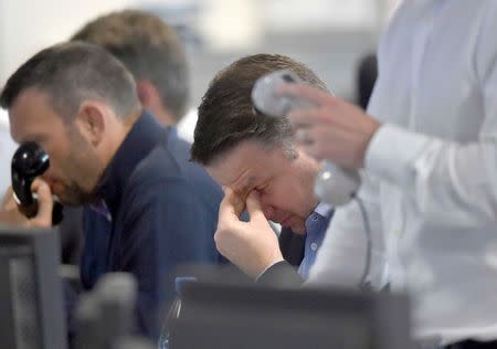 Brokers react on a trading floor at BGC, in the Canary Wharf financial district of London, Britain June 27, 2016. REUTERS/Toby Melville