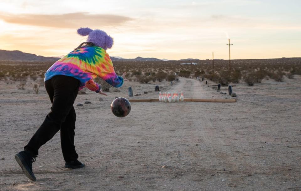 <div class="inline-image__caption"><p>An impromptu “lawn bowling” game at a campground for van lifers near Joshua Tree. With sparse amenities like a solar shower, kitchen, and composting toilet, it has all the features a nomad needs.</p></div> <div class="inline-image__credit">Winston Ross</div>