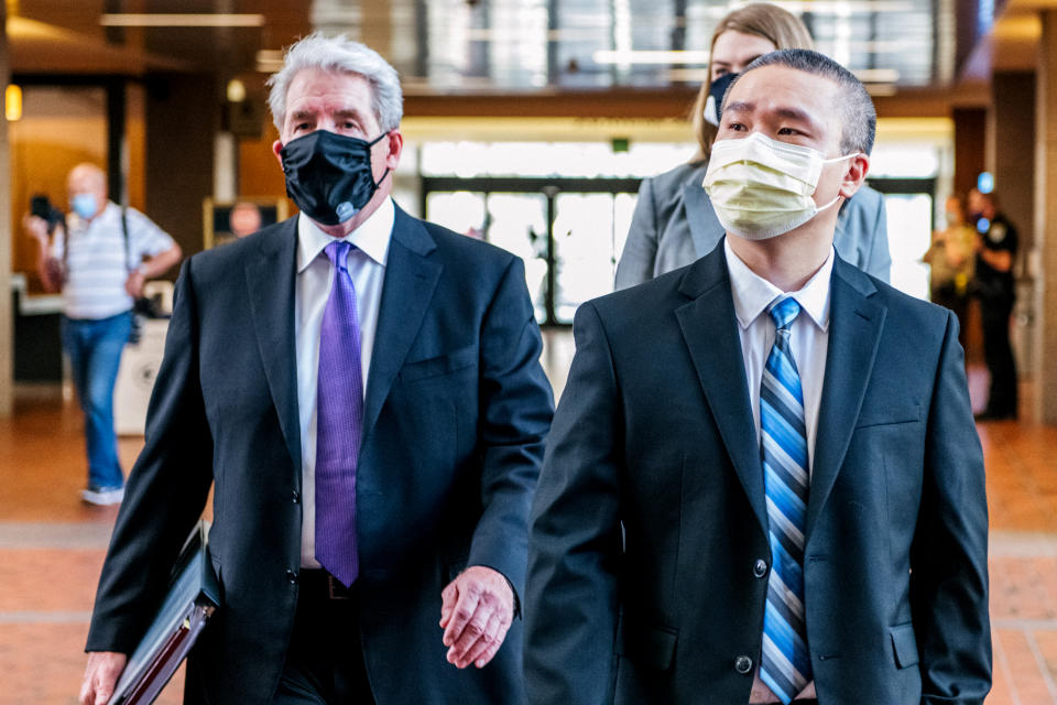 Former Minneapolis Police officer Tou Thao and his attorney Robert Paule arrive at the Hennepin County Government Center, ahead of a courthouse appearance, on July 21, 2020 in Minneapolis. (Brandon Bell / Getty Images file)