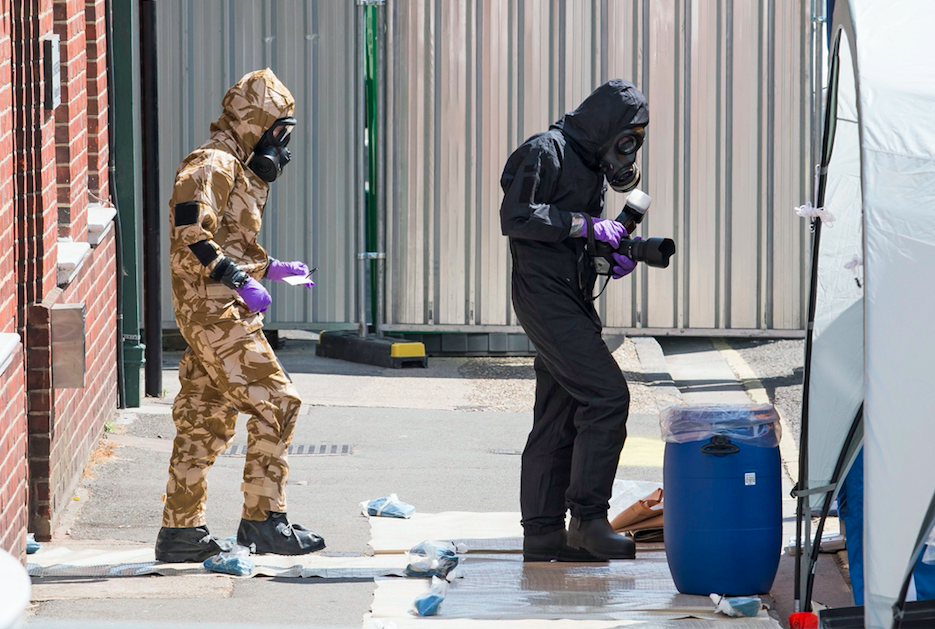 <em>Specialist teams wearing hazmat suits are seen at John Baker House in Salisbury, Wiltshire (Rex)</em>