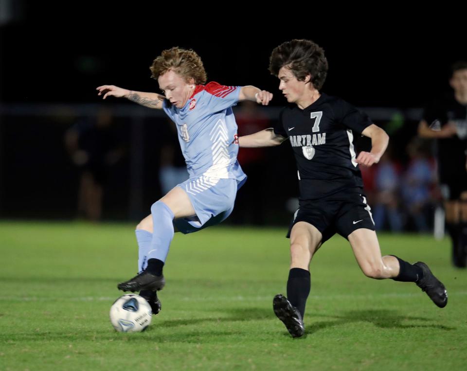 Seabreeze's Michael Hogan (10) battles for control of the ball with Bartram Trail during a game in Ormond Beach, Thursday, Jan. 5, 2023.