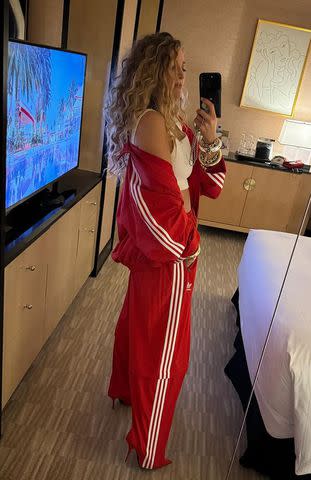 <p>Blake Lively/Instagram</p> Blake Lively takes a picture of her Adidas x Balenciaga tracksuit