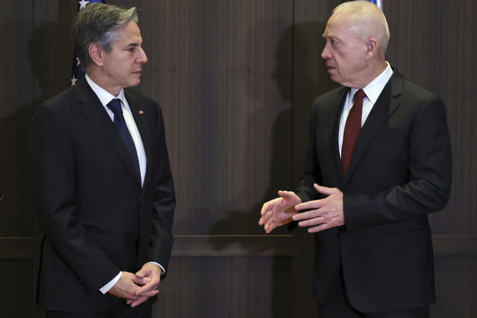 U.S. Secretary of State Antony Blinken, left, and Israeli Defense Minister Yoav Gallant talk ahead of their meeting in Jerusalem Tuesday, Jan. 31, 2023. (Ronaldo Schemidt/Pool Photo via AP)