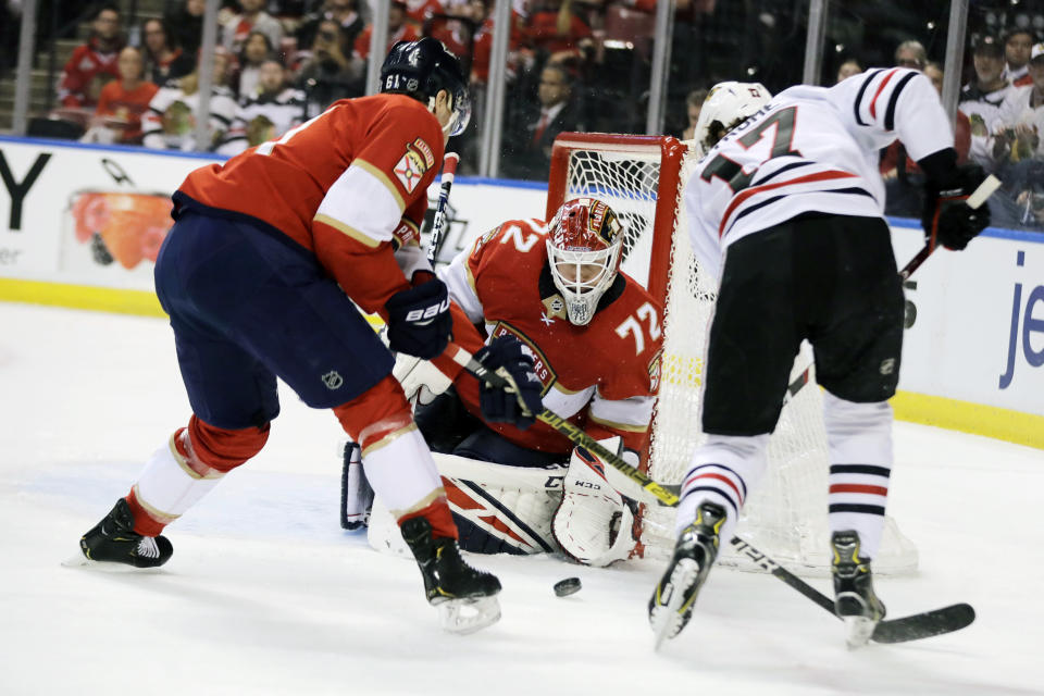 Florida Panthers goaltender Sergei Bobrovsky (72) defends the goal against Chicago Blackhawks center Dylan Strome (17) during the first period of an NHL hockey game, Saturday, Feb. 29, 2020, in Sunrise, Fla. (AP Photo/Brynn Anderson)