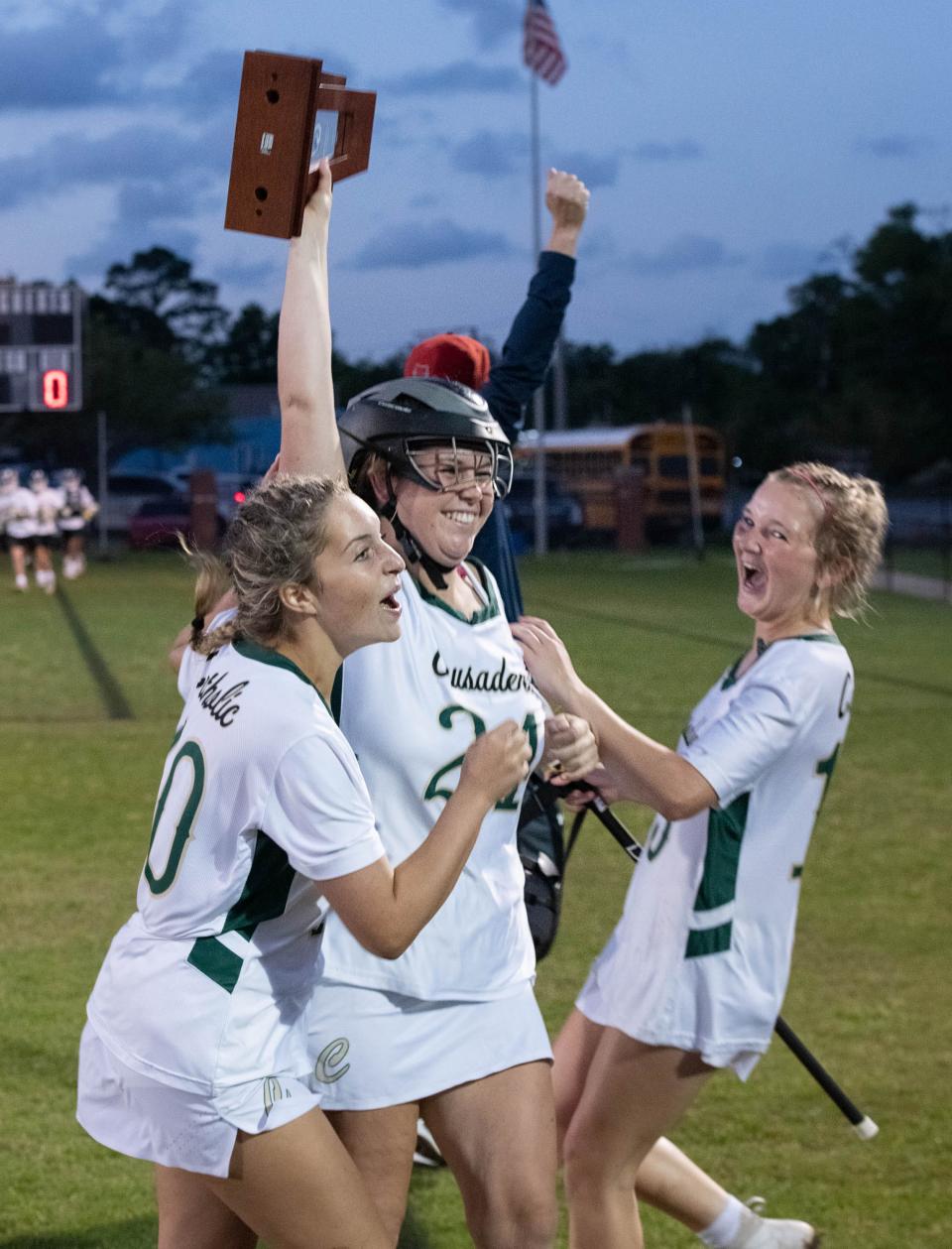 The Crusaders celebrate their 19-3 victory in the South Walton vs Catholic girls District 1-1A championship lacrosse game at Pensacola Catholic High School on Thursday, April 13, 2023.