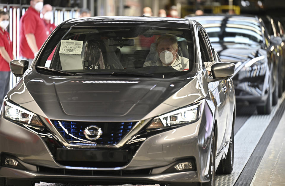 British Prime Minister Boris Johnson visits the Nissan Motor Co. plant, in Sunderland, England, Thursday, July 1, 2021. Japanese carmaker Nissan and two partners announced plans to invest 1 billion ($1.4 billion) pounds to produce a new model of an all-electric vehicle and batteries in northeast England, a major victory for the U.K. government’s efforts to attract jobs and investment following the country’s departure from the European Union. ( Jeff J Mitchell/Pool Photo via AP)