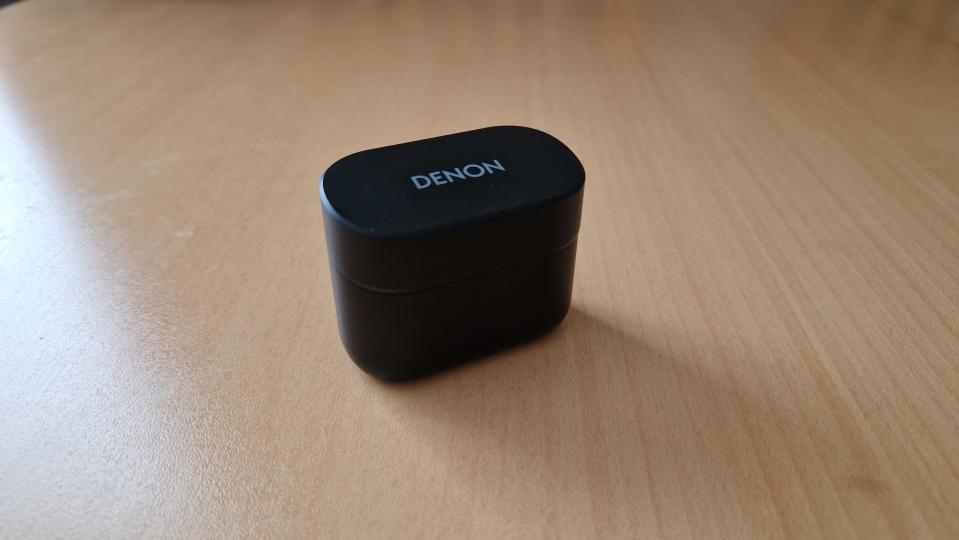 Denon Noise Cancelling Earbuds case showing the Denon logo