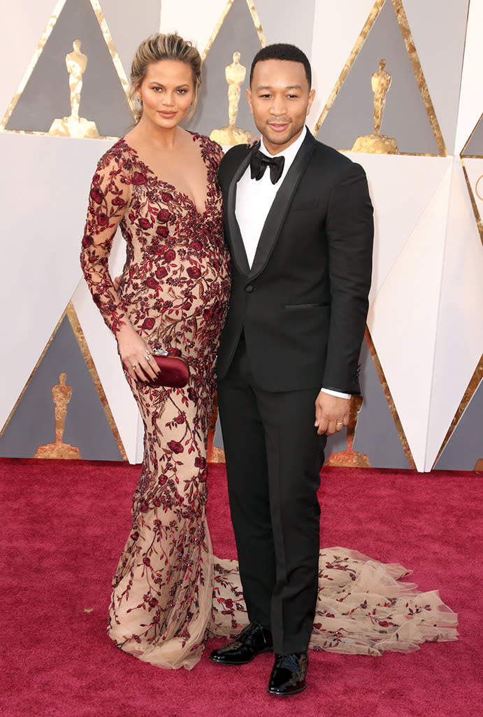 Chrissy Teigen and John Legend attend the 88th Annual Academy Awards at the Dolby Theatre on February 28, 2016, in Hollywood, California.