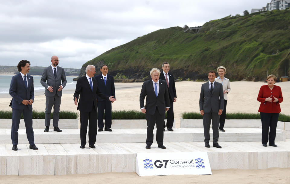 Leaders of the G7 pose for a group photo on overlooking the beach at the Carbis Bay Hotel in Carbis Bay, St. Ives, Cornwall, England, Friday, June 11, 2021. Leaders from left, Canadian Prime Minister Justin Trudeau, European Council President Charles Michel, U.S. President Joe Biden, Japan's Prime Minister Yoshihide Suga, British Prime Minister Boris Johnson, Italy's Prime Minister Mario Draghi, French President Emmanuel Macron, European Commission President Ursula von der Leyen and German Chancellor Angela Merkel. (Phil Noble, Pool via AP)