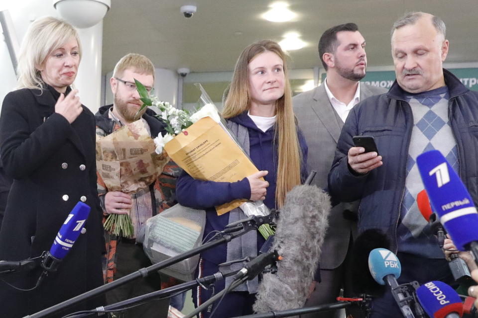 Russian citizen Maria Butina (center) is seen with her father Valery Butin (right) while talking to reporters in Russia following her deportation. (Photo: Mikhail Japaridze via Getty Images)