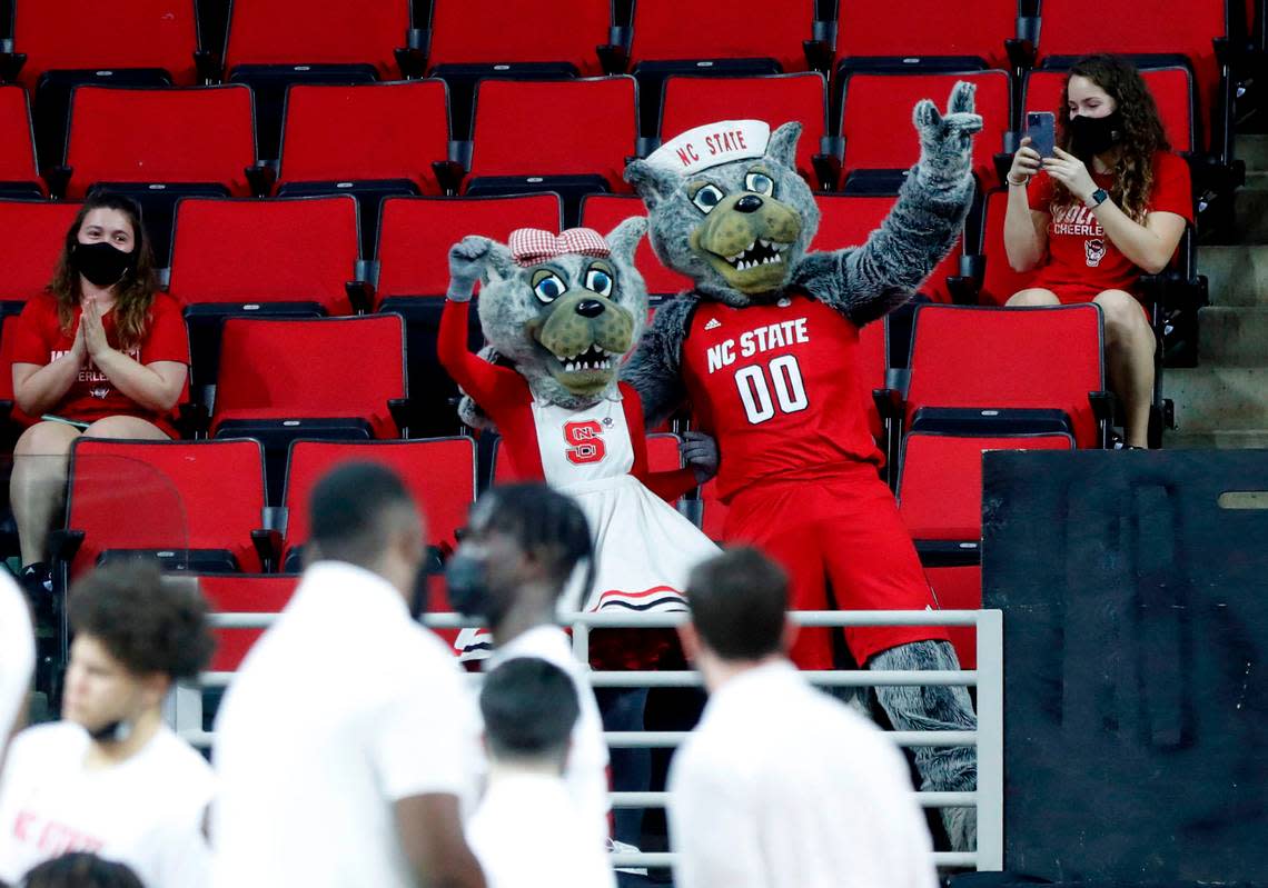 Mr. and Mrs. Wuf celebrate their 40th anniversary during the first half of N.C. State’s game against Pittsburgh at PNC Arena in Raleigh, N.C., Sunday, February 28, 2021. Ethan Hyman/ehyman@newsobserver.com