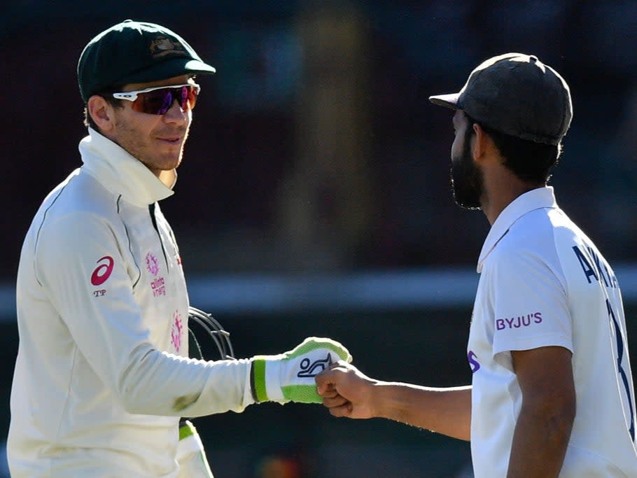 Paine fist bumps Ajinkya Rahane after India draw the TestAFP via Getty Images