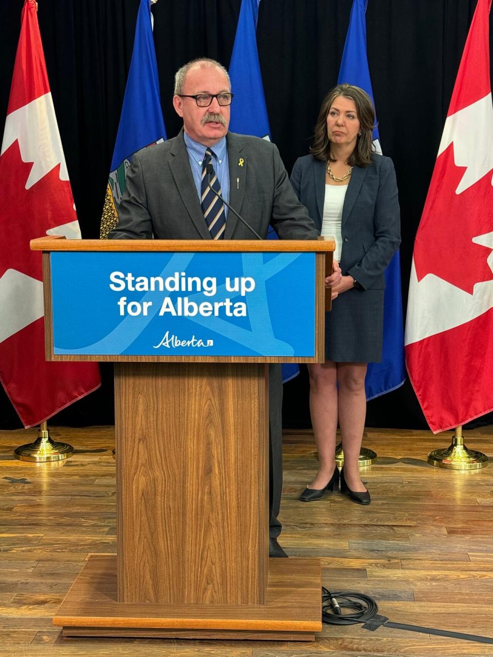Municipal Affairs Minister Ric McIver and Alberta Premier Danielle Smith at a news conference Wednesday detailing the Provincial Priorities Act. (Emilio Avalos/Radio Canada - image credit)