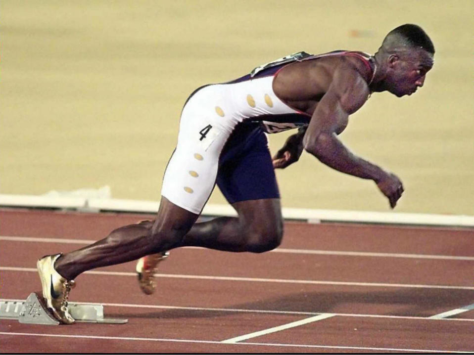 Michael Johnson from the US takes off in the men's Olympic 400m competition at the Olympic Stadium in Atlanta, Georgia, 29 July. Johnson blitzed to the 400m title with a time of 43.49sec, missing Butch Reynolds' eight-year world record by two tenths of a second. -Electronic Image- (FOR EDITORIAL USE ONLY) AFP-IOPP/Don EMMERT