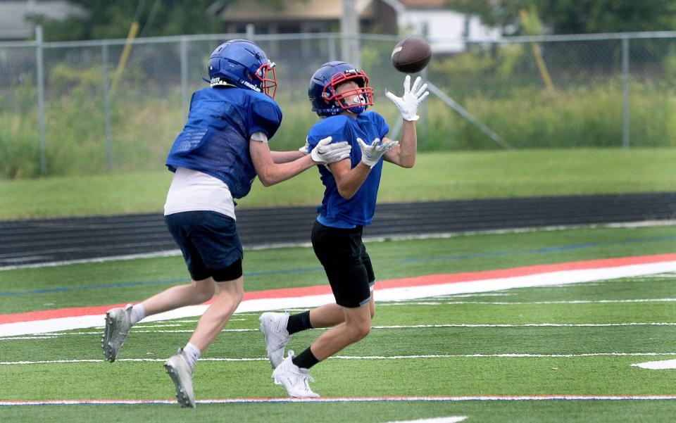 Carlinville High School's Triston Thompson catches a pass during a drill at practice Friday, August 11, 2023.