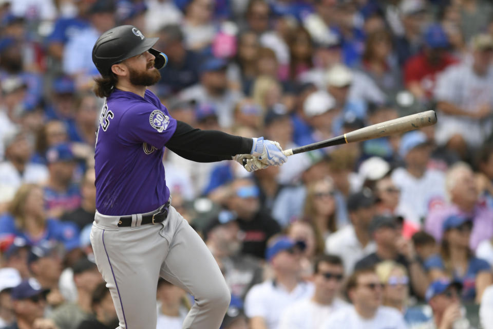 Colorado Rockies' Brendan Rodgers watches his two-run home run during the third inning of a baseball game against the Chicago Cubs, Sunday, Sept. 24, 2023, in Chicago. (AP Photo/Paul Beaty)