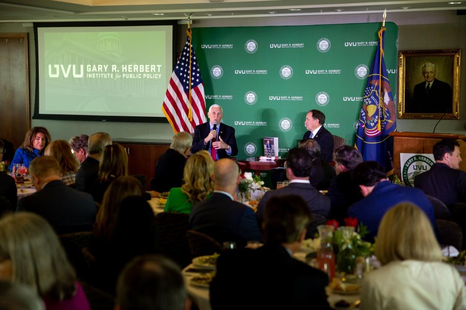 Former Vice President Mike Pence speaks with former Gov. Gary Herbert at an event at the Zions Bank Building in Salt Lake City on Friday, April 28, 2023. The event was hosted by the Gary R. Herbert Institute for Public Policy at Utah Valley University. | Spenser Heaps, Deseret News