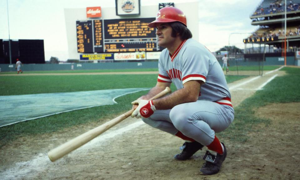 <span>Pete Rose crouches on the field before a game at Shea Stadium in New York on 24 July 1978 during a hitting streak that eventually spanned 44 consecutive games.</span><span>Photograph: Gary Gershoff/Getty Images</span>