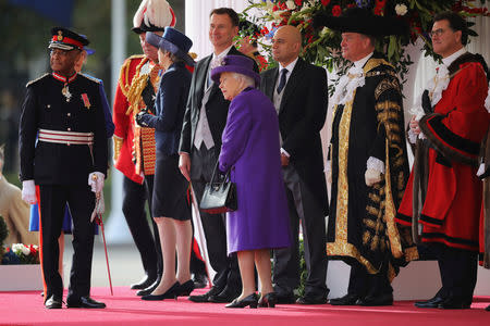 Britain's Prime Minister Theresa May, Secretary of State for Foreign Affairs Jeremy Hunt, Queen Elizabeth and Home Secretary Sajid Javid arrive ahead of the ceremonial welcome for King Willem-Alexander and Queen Maxima of the Netherlands at Horse Guards Parade, in London, Britain October 23, 2018. Christopher Furlong/Pool via REUTERS