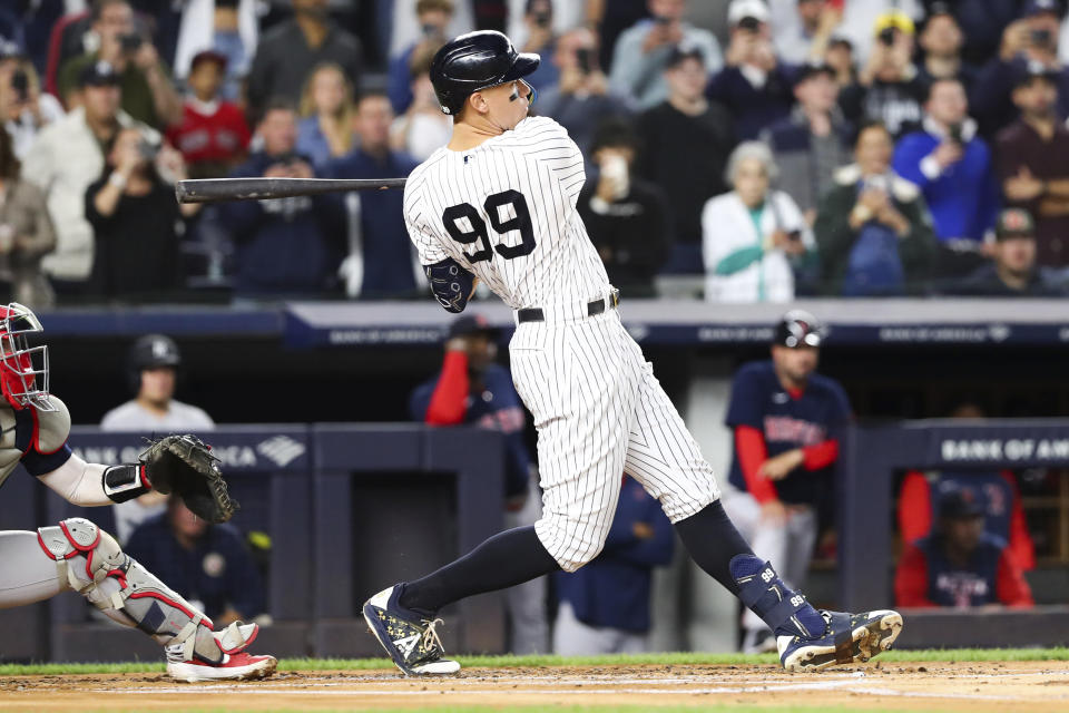 New York Yankees designated hitter Aaron Judge follows through on a double against Boston Red Sox starting pitcher Brayan Bello during the first inning of a baseball game Sunday, Sept. 25, 2022, in New York. (AP Photo/Jessie Alcheh)