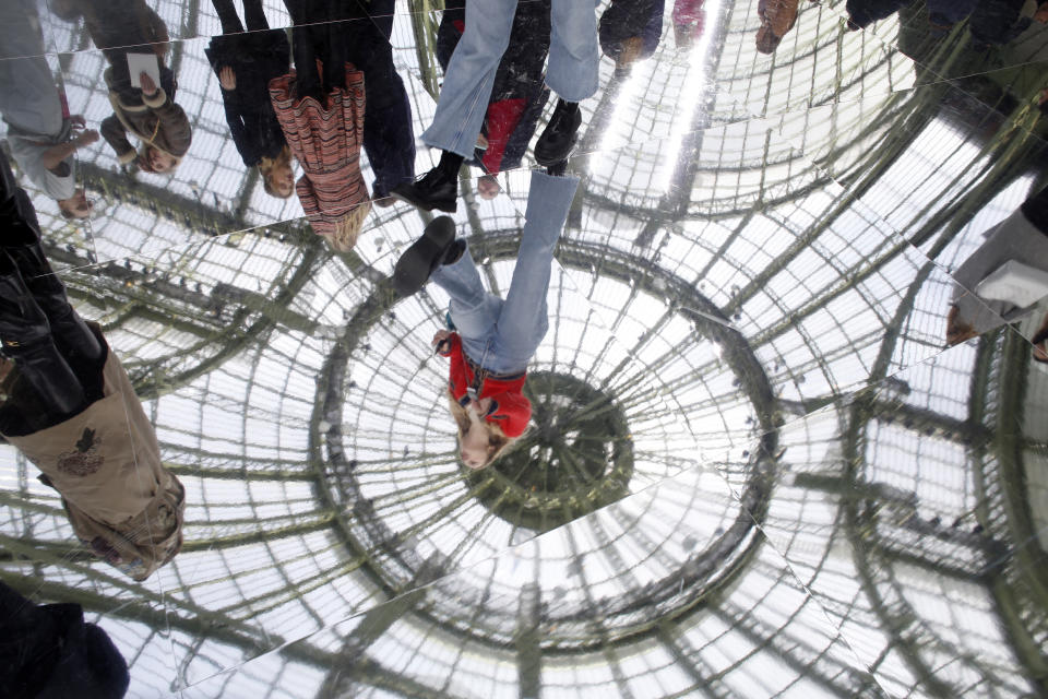 The glass roof of the Grand Palais is reflected on the floor during the Chanel fashion collection during Women's fashion week Fall/Winter 2020/21 presented Tuesday, March 3, 2020 in Paris. (AP Photo/Thibault Camus)