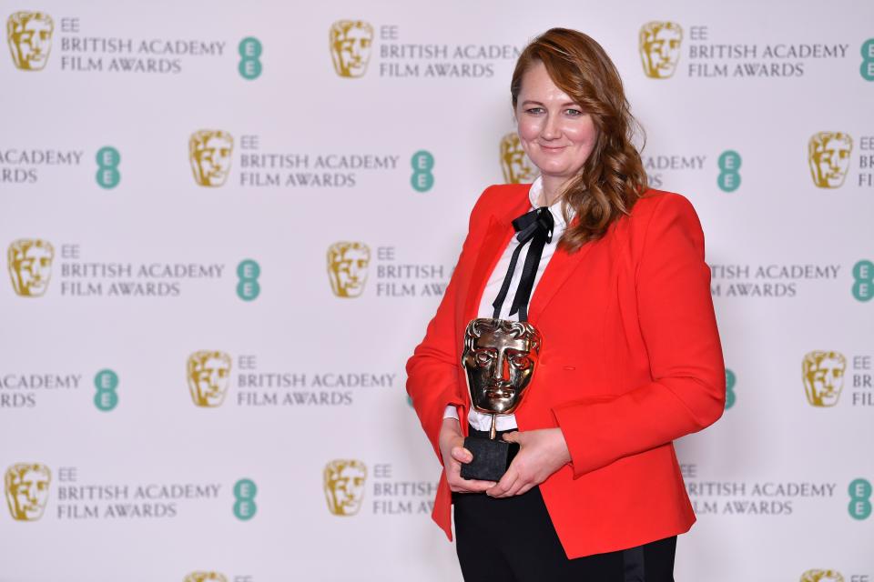 Hair and makeup designer Nadia Stacey pose with the award for Production Design for her work on the film 'The Favourite' at the BAFTA British Academy Film Awards at the Royal Albert Hall in London on February 10, 2019. (Photo by Ben STANSALL / AFP)        (Photo credit should read BEN STANSALL/AFP via Getty Images)