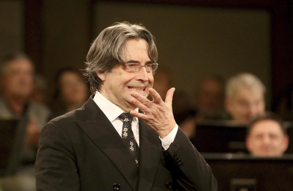 FILE - In this Dec. 30, 2017 file photo, Italian Maestro Riccardo Muti conducts the Vienna Philharmonic Orchestra during a rehearsal for the traditional New Year's concert at the golden hall of Vienna's Musikverein. With a purposeful nod and flick of his baton, the 79-year-old conductor on Sunday, May 9, 2021, ended what has been an unexpectedly long silence in Italian theaters, enrapturing a socially distanced and masked audience with the Vienna Philharmonic Orchestra’s first live performances since fall, two evening concerts of Mendelssohn, Schumann and Brahms, in his adopted hometown of Ravenna. (AP Photo/Ronald Zak, file)