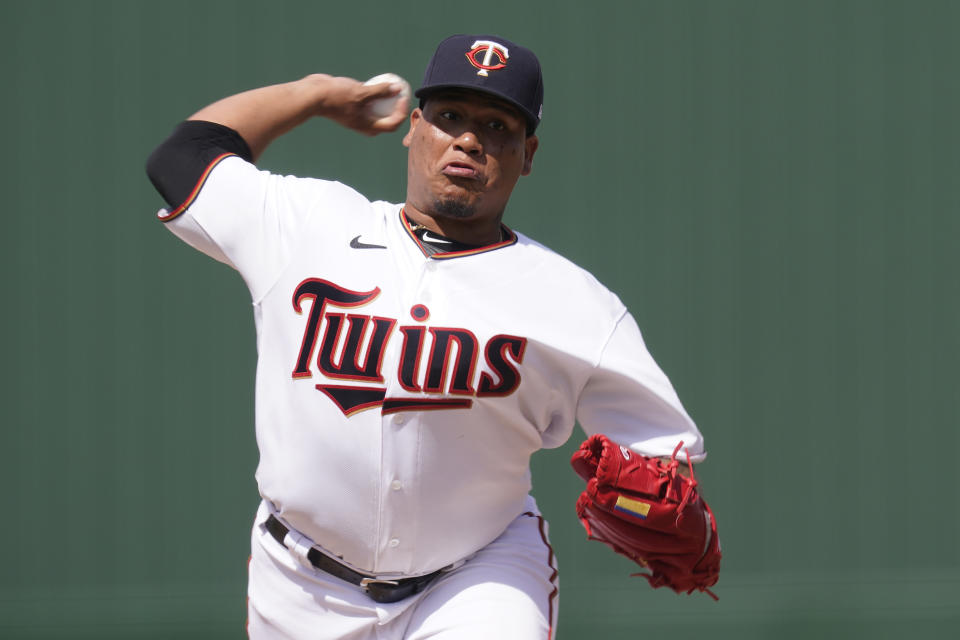 Minnesota Twins relief pitcher Jhon Romero (50) delivers a pitch in the eight inning during a spring training baseball game against the Pittsburgh Pirates at the Hammond Stadium Wednesday March 30, 2022, in Fort Myers, Fla. The Twins won the game 9-4. (AP Photo/Steve Helber)