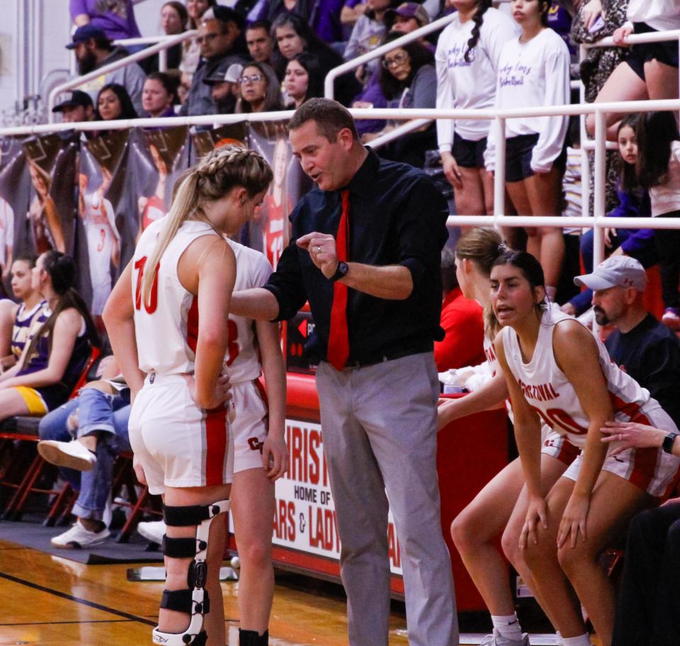 Christoval girls basketball coach Brad Blalock (middle) talks to Halle Hughes (10) during a timeout in a matchup against Ozona at Christoval High School on Friday, Jan. 26, 2024.