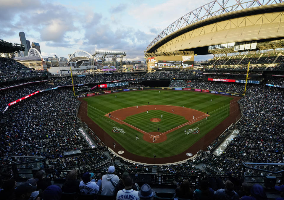 Fans watch the third inning of a baseball game between the Seattle Mariners and the Cleveland Guardians on Saturday, April 1, 2023, in Seattle. (AP Photo/Lindsey Wasson)