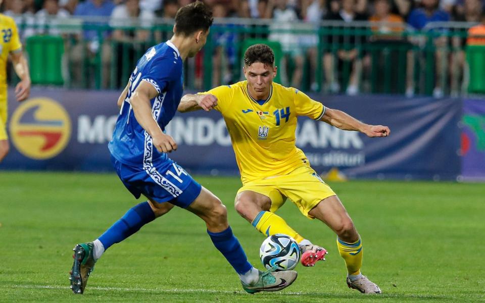 Georgiy Sudakov (R) of Ukraine in action against Artur Craciun (L) of Moldova during the friendly soccer match between Ukraine and Moldova in Chisinau, Moldova, 11 June 2024. Soccer international friendly