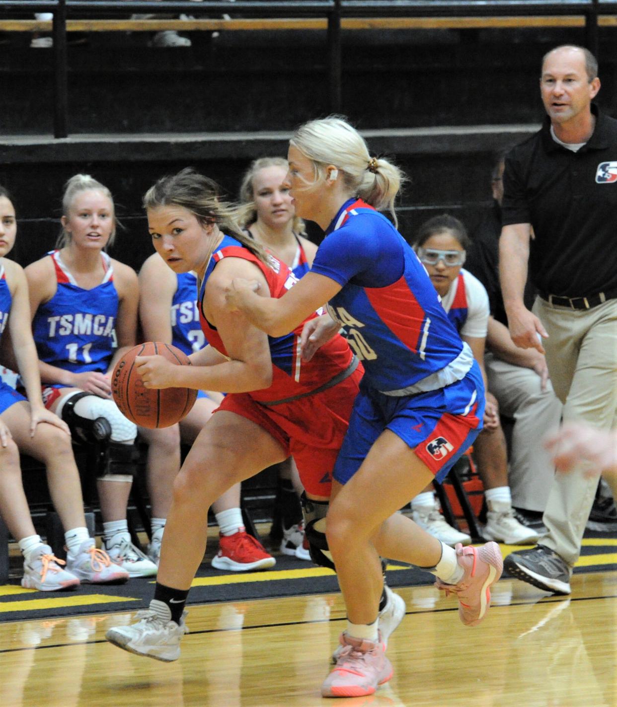 Richland Spring's Brynli Chandler dribbles the ball around Sand's Landry Morrow during the Six Man Coaches Association Girls All-Star game at Rider on Saturday, July 16, 2022.