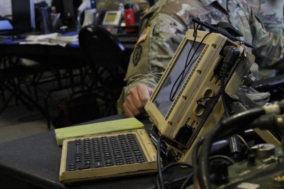 A Joint Capabilities Release (JCR) or friendly forces tracking system sits on a table. Soldiers use the JCR to track locations of friendly forces, plot enemy locations and exchange command and control messages.