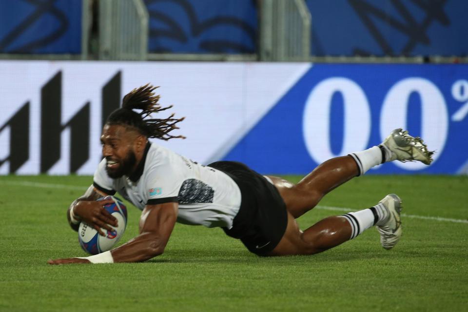 Fiji's Waisea Nayacalevu dives in to score a try (AP)