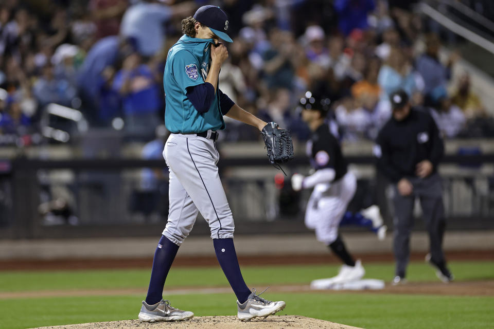 Seattle Mariners pitcher Logan Gilbert reacts after giving up a home run to New York Mets' Brandon Nimmo during the sixth inning of a baseball game Friday, Sept. 1, 2023, in New York. (AP Photo/Adam Hunger)