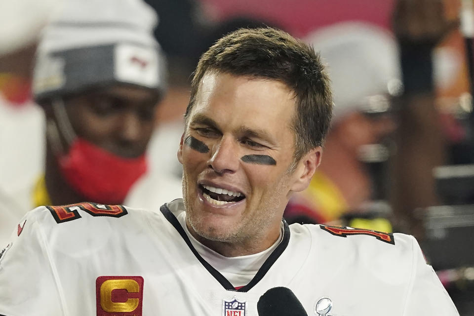 FILE - Tampa Bay Buccaneers quarterback Tom Brady (12) is interviewed on the field after the NFL Super Bowl 55 football game against the Kansas City Chiefs, in Tampa, Fla., Sunday, Feb. 7, 2021. Seven-time Super Bowl champion Tom Brady will join Fox sports as its lead football analyst once his playing career ends, the network said on Tuesday, May 10, 2022. When that actually happens is unclear, since Brady recently renounced his announced retirement and said he plans to continue playing for the Tampa Bay Bucs. (AP Photo/Steve Luciano, File)