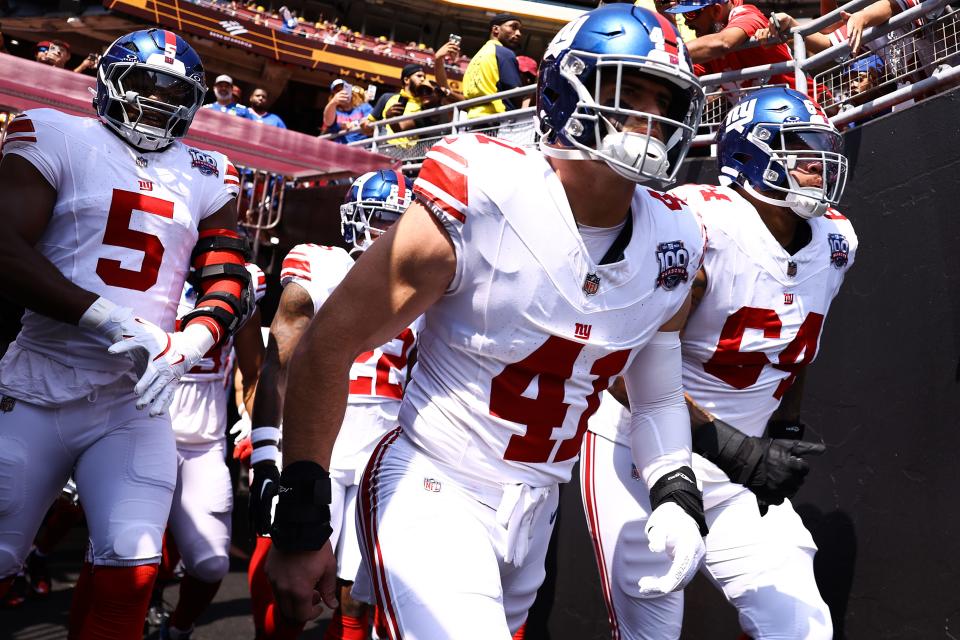 LANDOVER, MARYLAND - SEPTEMBER 15: Micah McFadden #41 of the New York Giants takes the field prior to a game against the Washington Commanders at Northwest Stadium on September 15, 2024 in Landover, Maryland. (Photo by Tim Nwachukwu/Getty Images)