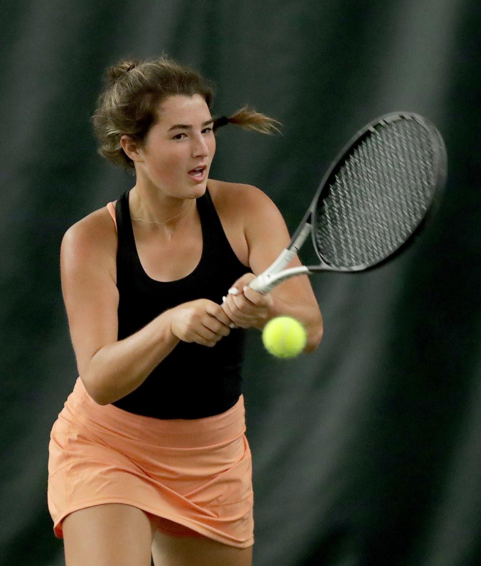 Hover's Tess Bucher returns a shot from Boardman's Ava Valko at Hall of Fame Fitness Center Wednesday, August 18, 2021.