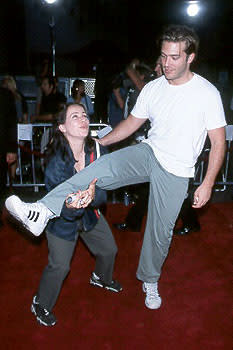 The lovely and talented Janeane Garofalo attempting to hoist Craig Bierko into the heavens with her Herculean strength at the LA premiere for South Park: Bigger, Longer & Uncut Photo by Jeff Vespa