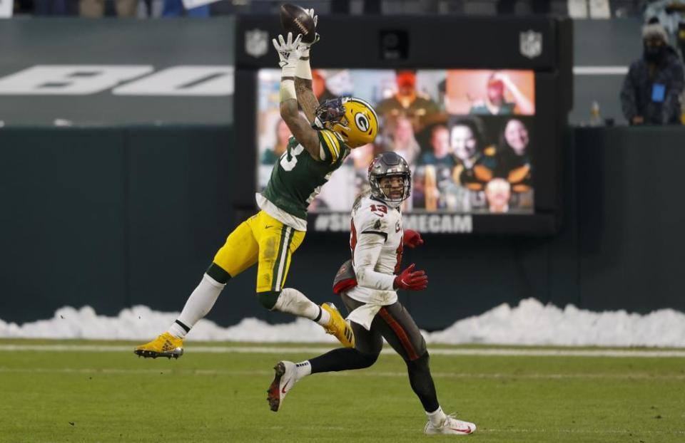 Green Bay’s Jaire Alexander intercepts a pass intended for Tampa Bay’s Mike Evans