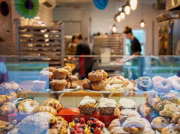 DeLuxe Cakes and Pastries owner Jamie Powers claims the five must try items are the chocolate almond croissant, any of the baguette sandwiches, the chocolate chip cookies, a dirty chai latte with oat milk and any of the quiche options on the weekend.