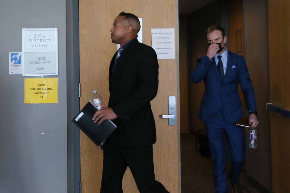 Former Williamson County sheriff's Deputies J.J. Johnson, left, and Zach Camden leave a 2021 court hearing. Testimony will begin Monday in the manslaughter trial of Camden and Johnson in the 2019 death of Javier Ambler II.